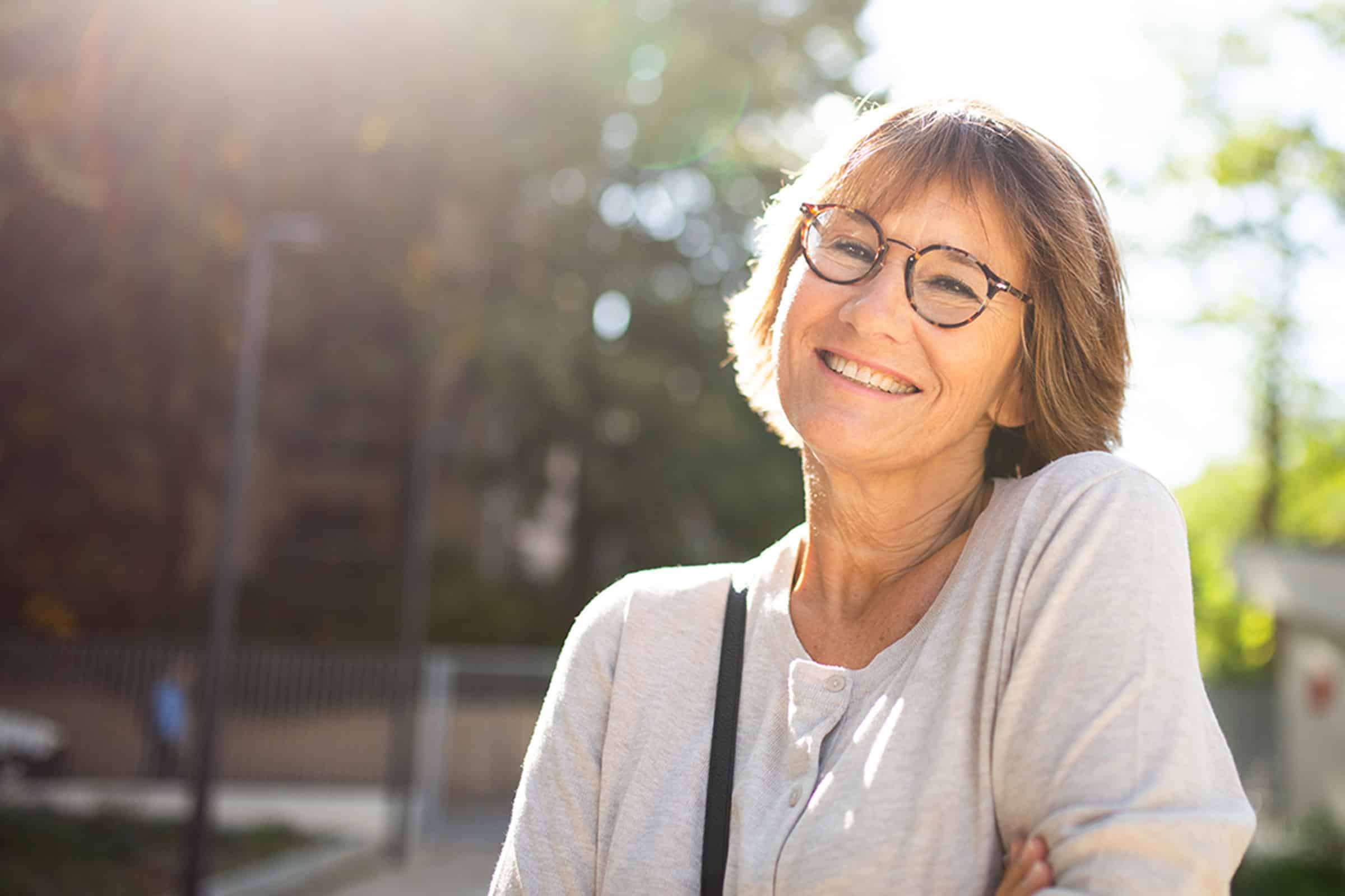 Woman smiling after getting cosmetic dental treatments near St. Johns, FL