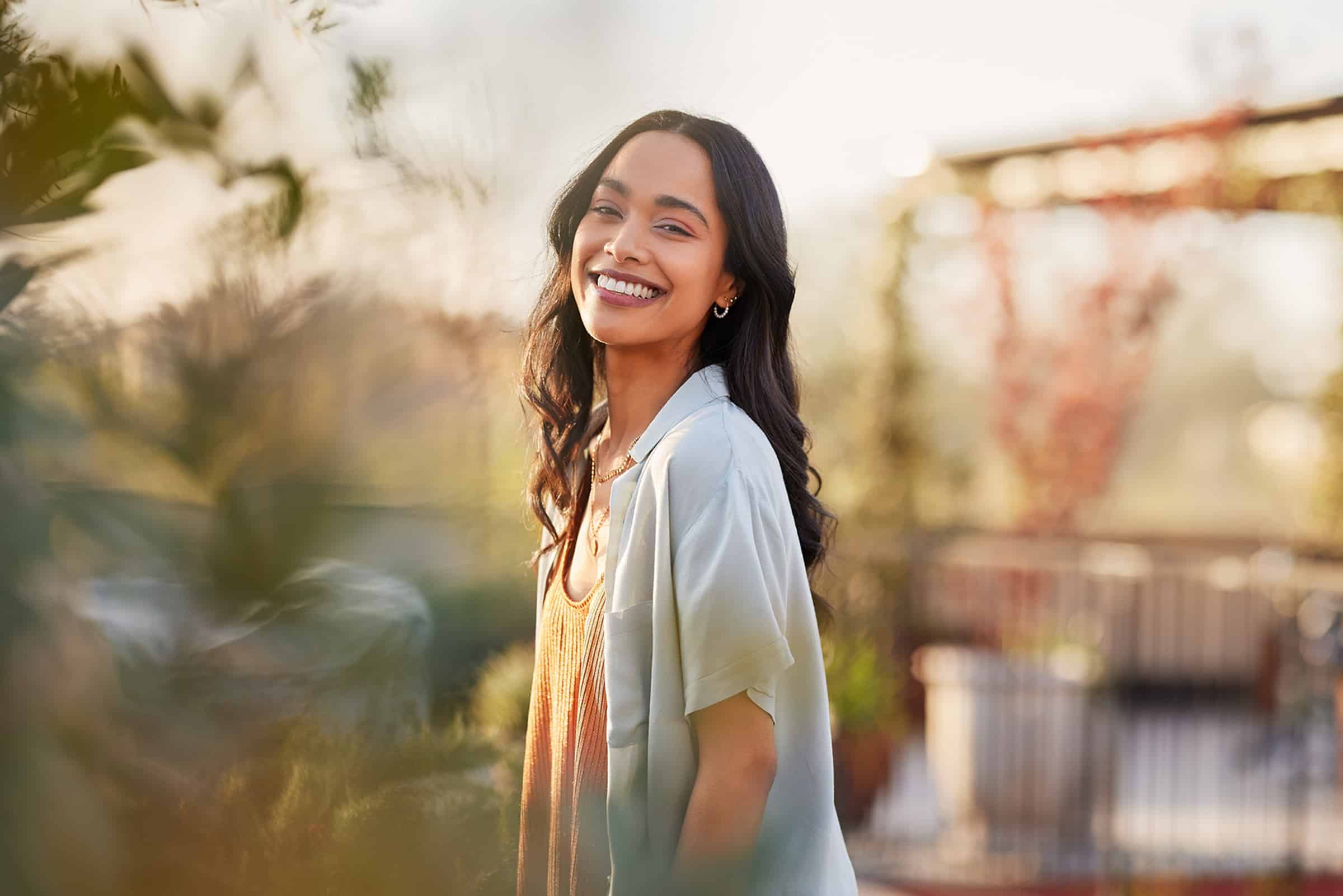 Woman smiling after preventive dental treatments in St. Johns, FL