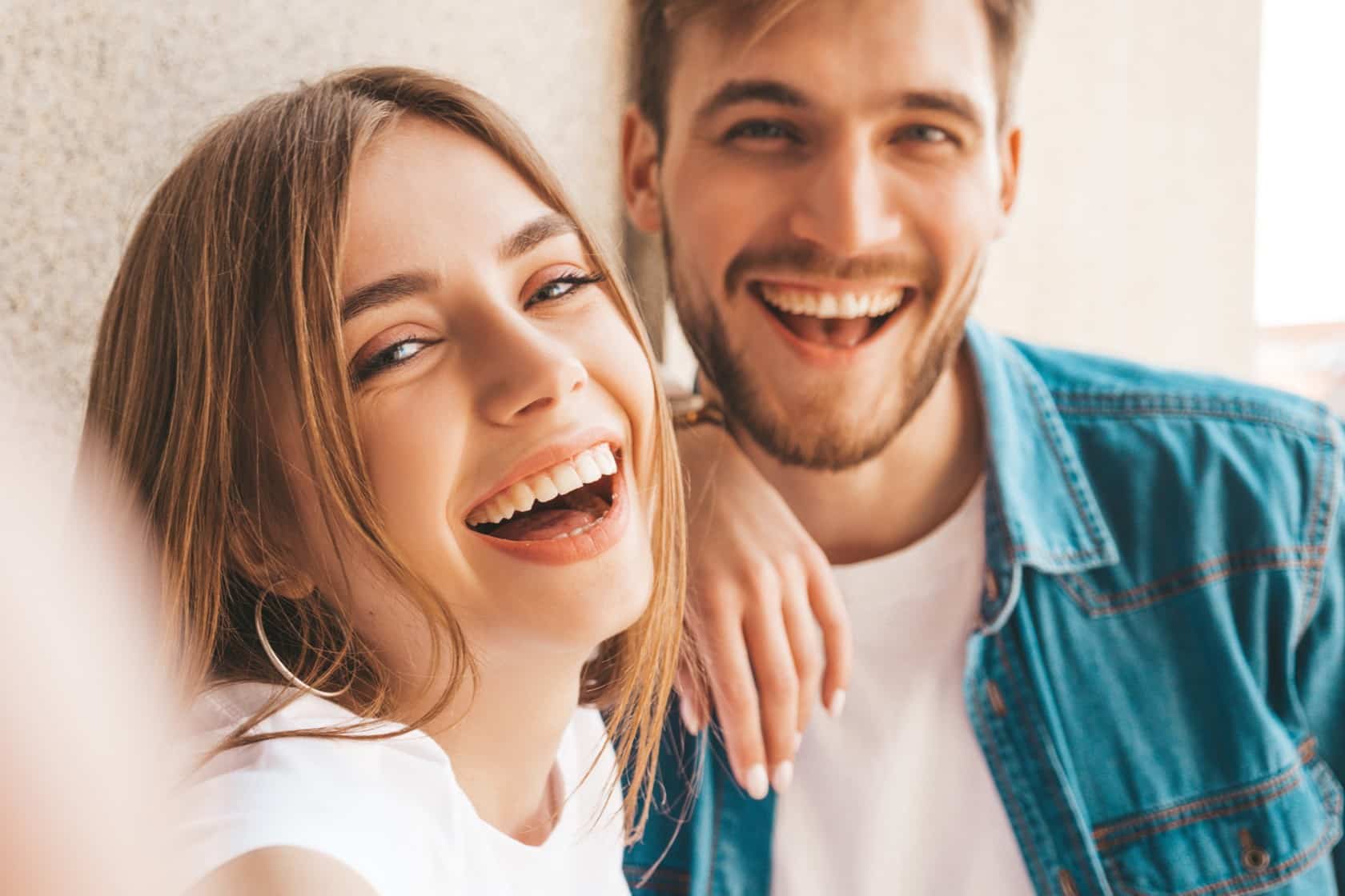 Man and woman smiling after gum surgery in St Johns FL