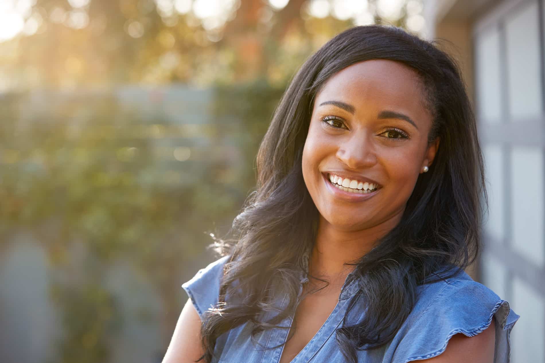 Woman smiling with her temorary dental restorations in St Johns FL