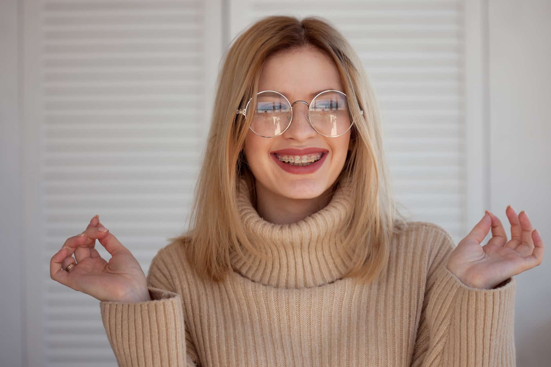 Woman wearing braces after orthodontic treatment in St. Johns FL
